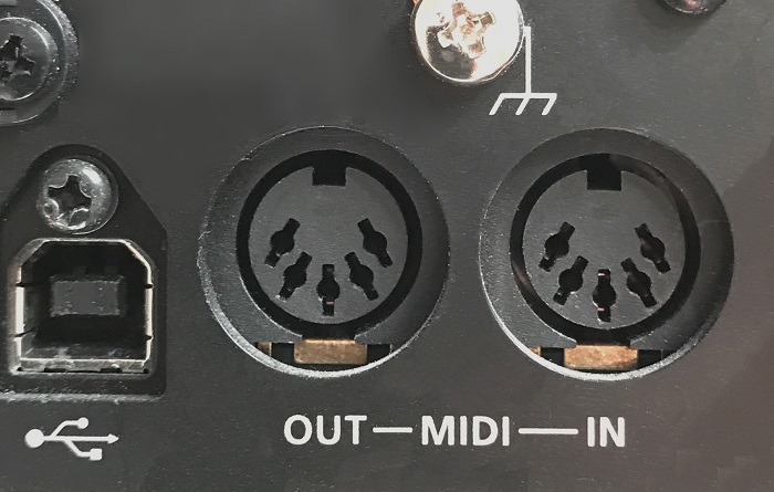 A USB connector is on the left; 5-pin MIDI connectors for MIDI out and MIDI in are on the right.
